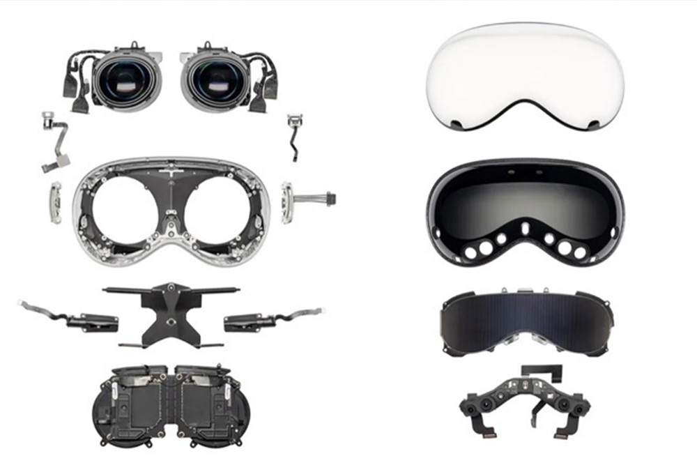 Darstellung des Apple Vision Pro Headsets mit separaten Komponenten wie Linsen, Rahmen und elektronischen Bauteilen.